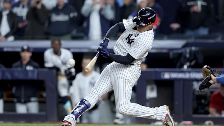Oct 29, 2024; New York, New York, USA; New York Yankees outfielder Juan Soto (22) doubles during the eighth inning against the Los Angeles Dodgers in game four of the 2024 MLB World Series at Yankee Stadium. Mandatory Credit: Brad Penner-Imagn Images