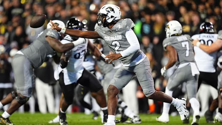 Oct 26, 2024; Boulder, Colorado, USA; Colorado Buffaloes quarterback Shedeur Sanders (2) pitches the ball in the second quarter against the Cincinnati Bearcats at Folsom Field. Mandatory Credit: Ron Chenoy-Imagn Images