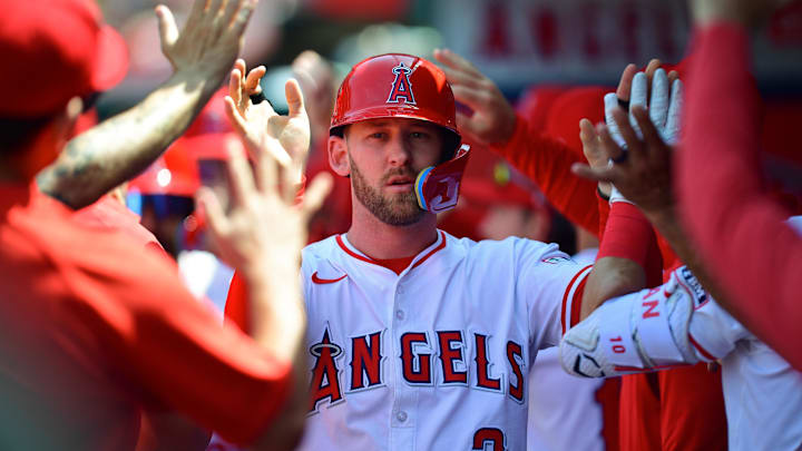 Jun 11, 2025; Anaheim, California, USA; Los Angeles Angels left fielder Taylor Ward (3) is greeted after scoring a run against the Athletics during the sixth inning at Angel Stadium. Mandatory Credit: Gary A. Vasquez-Imagn Images