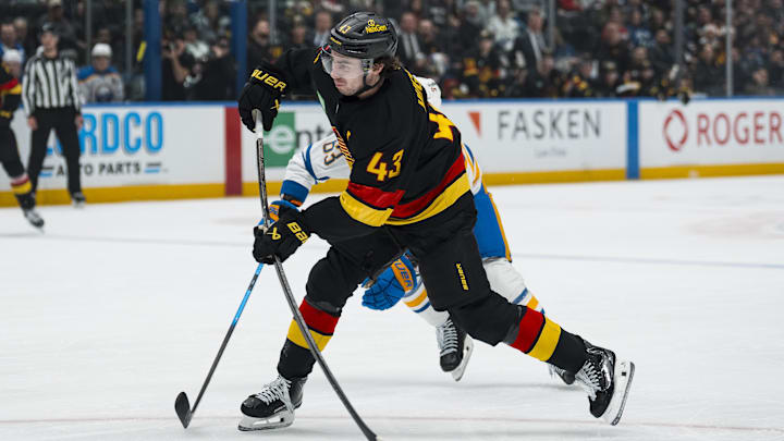 Dec 11, 2025; Vancouver, British Columbia, CAN; Vancouver Canucks defenseman Quinn Hughes (43) shoots against the Buffalo Sabres in the first period at Rogers Arena. Mandatory Credit: Bob Frid-Imagn Images Dec 11, 2025; Vancouver, British Columbia, CAN; Vancouver Canucks defenseman Quinn Hughes (43) shoots against the Buffalo Sabres in the first period at Rogers Arena. Mandatory Credit: Bob Frid-Imagn Images