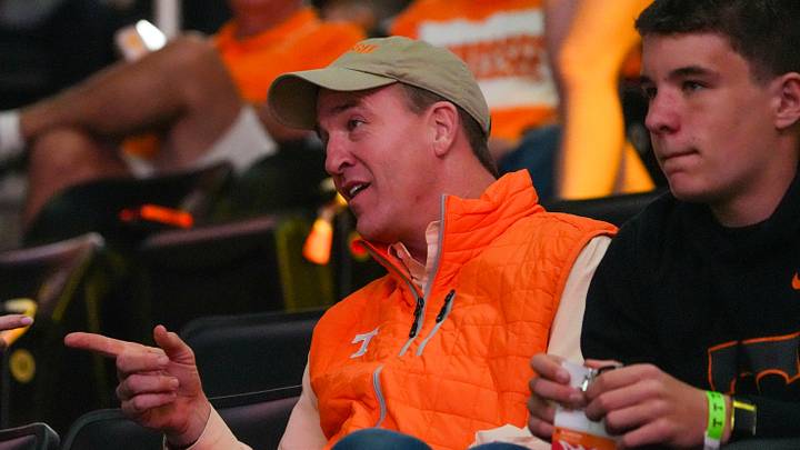 Former Tennessee football player Peyton Manning speaks with a fan during an NCAA basketball game between Tennessee and Alabama at Thompson-Boling Arena at Food City Center in Knoxville, Tenn., on Feb. 28, 2026.