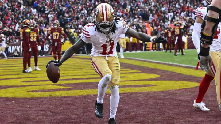 Dec 31, 2023; Landover, Maryland, USA; San Francisco 49ers wide receiver Brandon Aiyuk (11) celebrates after scoring a touchdown against the Washington Commanders during the second half at FedExField. Mandatory Credit: Brad Mills-USA TODAY Sports Dec 31, 2023; Landover, Maryland, USA; San Francisco 49ers wide receiver Brandon Aiyuk (11) celebrates after scoring a touchdown against the Washington Commanders during the second half at FedExField. Mandatory Credit: Brad Mills-USA TODAY Sports