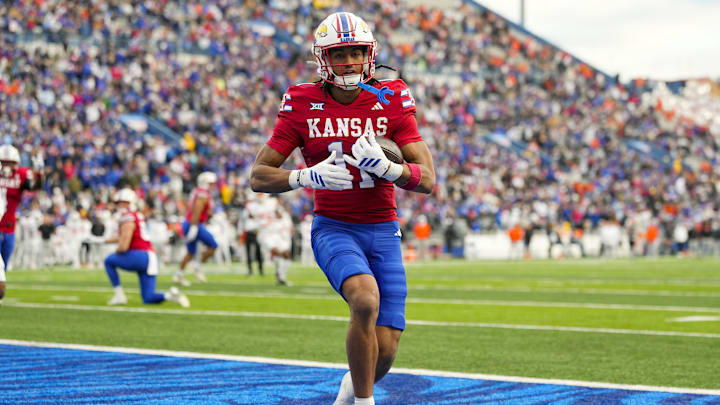 Nov 1, 2025; Lawrence, Kansas, USA; Kansas Jayhawks wide receiver Bryson Canty (11) scores a touchdown during the second half against the Oklahoma State Cowboys at David Booth Kansas Memorial Stadium. Mandatory Credit: Jay Biggerstaff-Imagn Images