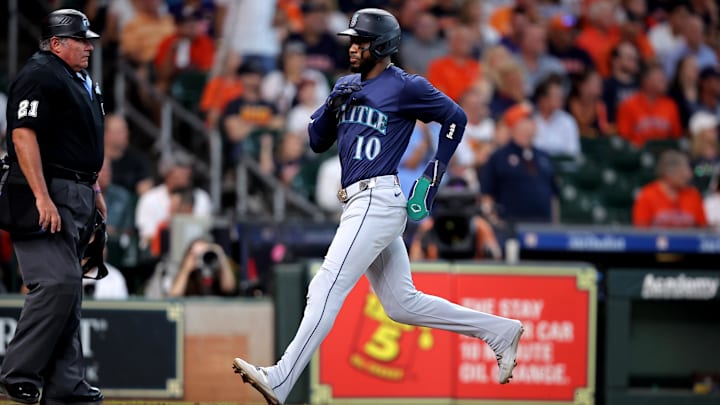 Seattle Mariners right fielder Victor Robles scores during a game against the Houston Astros on Wednesday at Minute Maid Park.