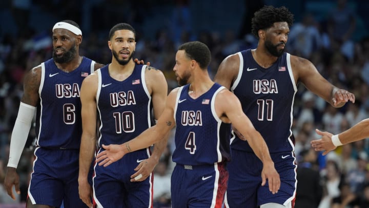 United States guard LeBron James (6), small forward Jayson Tatum (10), shooting guard Stephen Curry (4) and center Joel Embiid (11) in the second quarter against Puerto Rico during the Paris 2024 Olympic Summer Games at Stade Pierre-Mauroy. Mandatory Credit:
