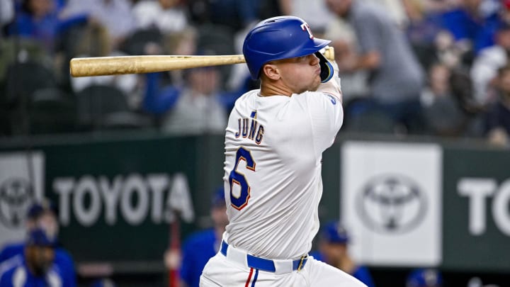 Mar 31, 2024; Arlington, Texas, USA; Texas Rangers third baseman Josh Jung (6) at bat during the game between the Texas Rangers and the Chicago Cubs at Globe Life Field. 