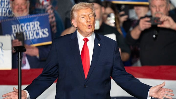 President Donald Trump takes the stage during a rally at Horizon Events Center on Tuesday, Jan. 27, 2026 in Clive.