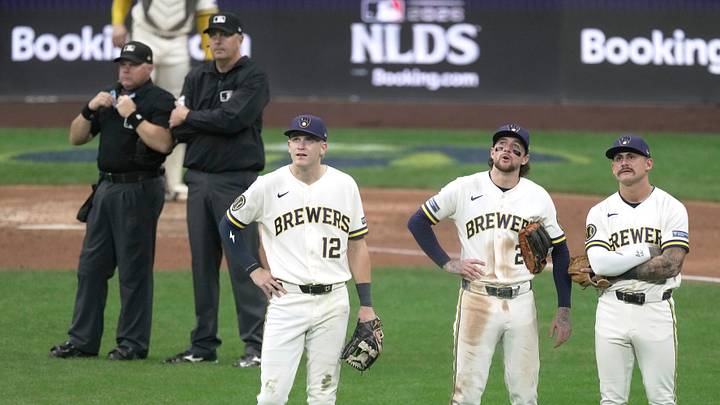 Milwaukee Brewers shortstop Cooper Pratt (12), =second baseman Brice Turang (2) and shortstop Joey Ortiz (3) watch a replay during the ninth inning of their National League Division Series game against the San Diego Padres Saturday, October 3, 2026 at American Family Field in Milwaukee, Wisconsin. Milwaukee Brewers shortstop Cooper Pratt (12), =second baseman Brice Turang (2) and shortstop Joey Ortiz (3) watch a replay during the ninth inning of their National League Division Series game against the San Diego Padres Saturday, October 3, 2026 at American Family Field in Milwaukee, Wisconsin.