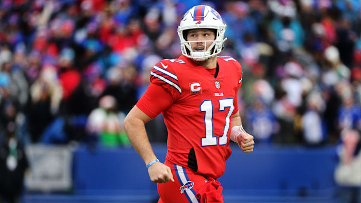 Bills QB Josh Allen comes off the field after one of his three touchdown passes against the Panthers. 