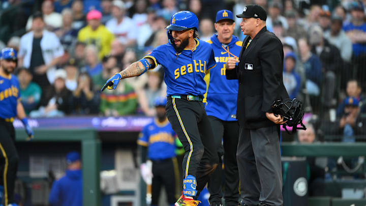 Seattle Mariners shortstop J.P. Crawford (left) argues with home plate umpire Andy Fletcher (right) during a game against the Washington Nationals on May 29 at T-Mobile Park.