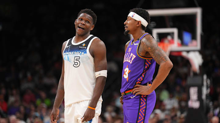 Mar 2, 2025; Phoenix, Arizona, USA; Minnesota Timberwolves guard Anthony Edwards (5) and Phoenix Suns guard Bradley Beal (3) talk during the second half at Footprint Center. Mandatory Credit: Joe Camporeale-Imagn Images