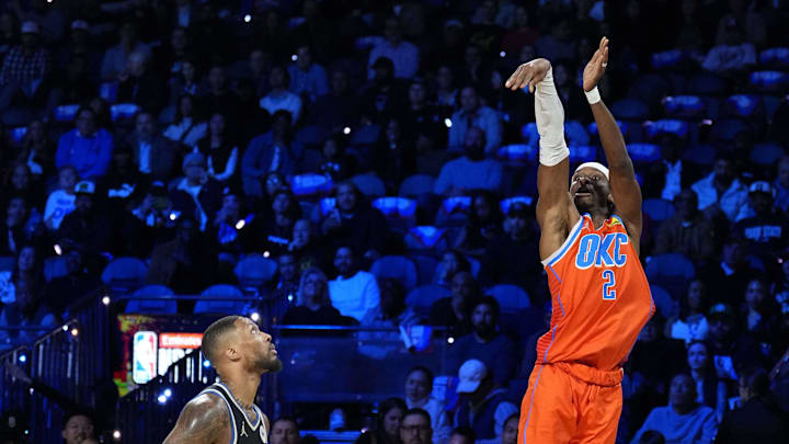 Dec 17, 2024; Las Vegas, Nevada, USA; Oklahoma City Thunder guard Shai Gilgeous-Alexander (2) shoots against Milwaukee Bucks guard Damian Lillard (0) during the 1st quarter of the Emirates NBA Cup championship game at T-Mobile Arena. Mandatory Credit: Kyle Terada-Imagn Images Dec 17, 2024; Las Vegas, Nevada, USA; Oklahoma City Thunder guard Shai Gilgeous-Alexander (2) shoots against Milwaukee Bucks guard Damian Lillard (0) during the 1st quarter of the Emirates NBA Cup championship game at T-Mobile Arena. Mandatory Credit: Kyle Terada-Imagn Images