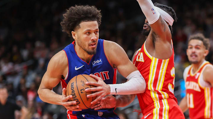 Dec 18, 2023; Atlanta, Georgia, USA; Detroit Pistons guard Cade Cunningham (2) is defended by Atlanta Hawks guard Wesley Matthews (32) in the second half at State Farm Arena. Mandatory Credit: Brett Davis-Imagn Images