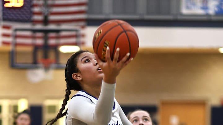 Alyssa Hopps takes a lay up for two points.

The Quincy High Presidents hosted the Hopkinton Hillers in girls MIAA basketball playoffs on Friday, March. 1, 2024