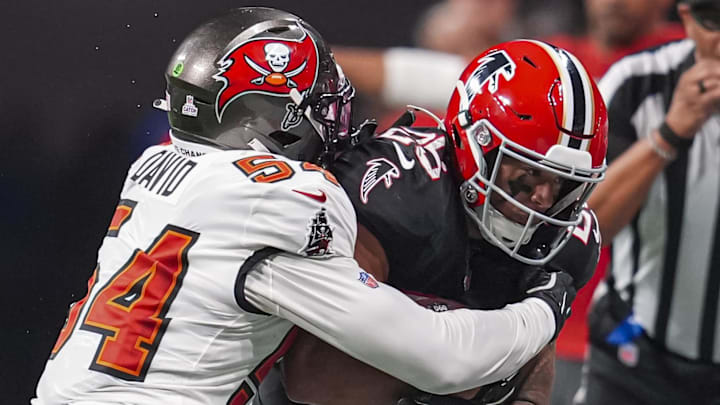 Oct 3, 2024; Atlanta, Georgia, USA; Atlanta Falcons running back Tyler Allgeier (25) is taken out of bounds by Tampa Bay Buccaneers linebacker Lavonte David (54) during the first half at Mercedes-Benz Stadium. Mandatory Credit: Dale Zanine-Imagn Images