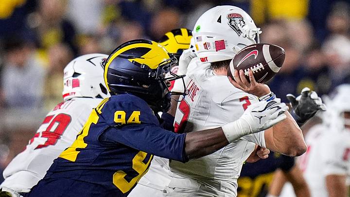 Michigan edge Nate Marshall (94) tackles New Mexico quarterback Jack Layne (2) during the second half at Michigan Stadium in Ann Arbor on Saturday, August 30, 2025. Michigan edge Nate Marshall (94) tackles New Mexico quarterback Jack Layne (2) during the second half at Michigan Stadium in Ann Arbor on Saturday, August 30, 2025.