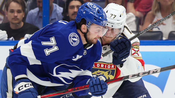 Apr 24, 2025; Tampa, Florida, USA; Florida Panthers defenseman Niko Mikkola (77) blocks Tampa Bay Lightning center Anthony Cirelli (71) during the third period in game two of the first round of the 2025 Stanley Cup Playoffs at Amalie Arena. Mandatory Credit: Nathan Ray Seebeck-Imagn Images
