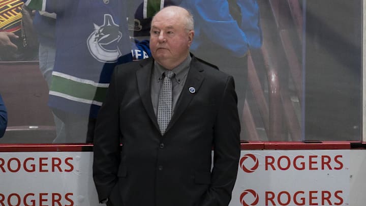 Jan 20, 2023; Vancouver, British Columbia, CAN; Vancouver Canucks head coach Bruce Boudreau watches from the bench during warm up prior to a game against the Colorado Avalanche at Rogers Arena. . Mandatory Credit: Bob Frid-Imagn Images
