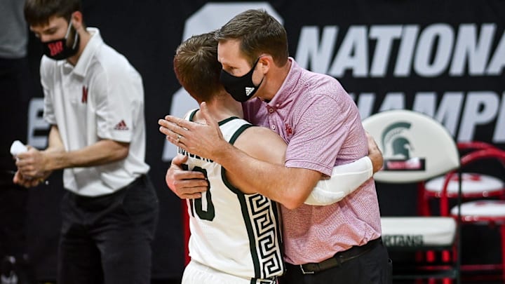 Michigan State's Jack Hoiberg hugs his father, Nebraska head coach Fred Hoiberg, after the game on Feb. 6, 2021.