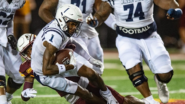 ULM Warhawks' safety Carl Fauntroy (8) tackles Jackson State Tigers' wide receiver Rico Powers, Jr. (1) during the game in Monroe, La., on Thursday, Aug. 29, 2024.