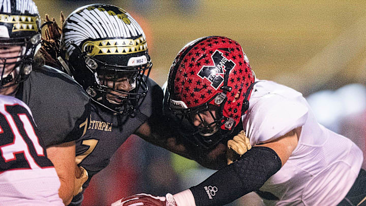 Wetumpka's Terrance Thomas (1) is stopped by Muscle Shoals' Jackson Bratton (2) at Hohenberg Stadium in Wetumpka, Ala., on Friday October 25, 2019.
