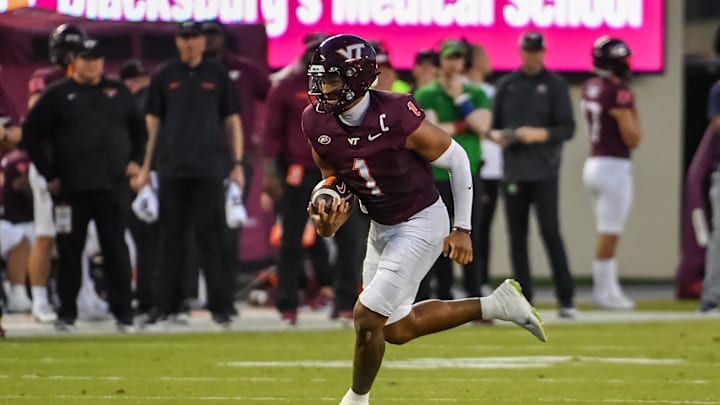 Sep 13, 2025; Blacksburg, Virginia, USA;  Virginia Tech Hokies cornerback Dante Lovett (1) runs the ball during the first quarter at Lane Stadium. Mandatory Credit: Brian Bishop-Imagn Images