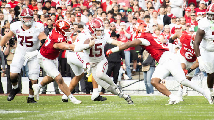 Alabama quarterback Ty Simpson hits the Heisman pose to avoid a tackle in the first half of the Rose Bowl on Jan. 1, 2026.