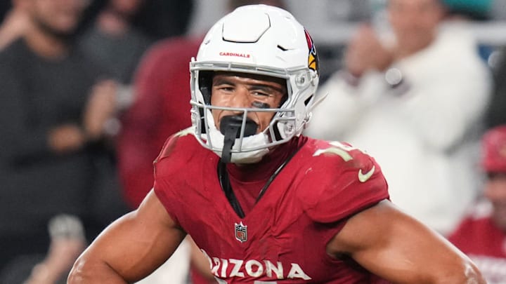 Arizona Cardinals receiver Michael Wilson (14) celebrates his catch over Jacksonville Jaguars cornerback Christian Braswell (21) at State Farm Stadium on Nov. 23, 2025.