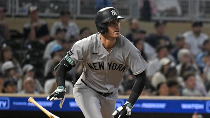 Sep 17, 2025; Minneapolis, Minnesota, USA;  New York Yankees outfielder Cody Bellinger (35) hits a two-run home run against the Minnesota Twins during the ninth inning at Target Field. Mandatory Credit: Nick Wosika-Imagn Images

