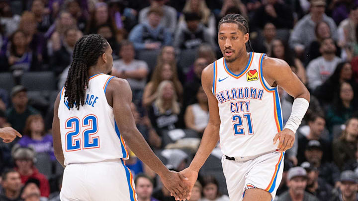 Nov 25, 2024; Sacramento, California, USA; Oklahoma City Thunder guard Cason Wallace (22) high fives guard Aaron Wiggins (21) during the second quarter of the game against the Sacramento Kings at Golden 1 Center. Mandatory Credit: Ed Szczepanski-Imagn Images