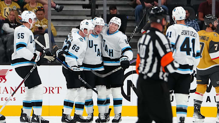 Sep 27, 2024; Las Vegas, Nevada, USA; Utah Hockey Club forward Ryan McGregor (16) celebrates with Utah Hockey Club forward Ben McCartney (62) and Utah Hockey Club forward Aku Raty (85) after scoring a goal against the Vegas Golden Knights during the second period at T-Mobile Arena. Mandatory Credit: Stephen R. Sylvanie-Imagn Images
