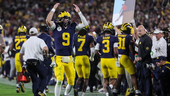 Michigan quarterback J.J. McCarthy celebrates a play against Alabama during overtime of the Rose Michigan quarterback J.J. McCarthy celebrates a play against Alabama during overtime of the Rose