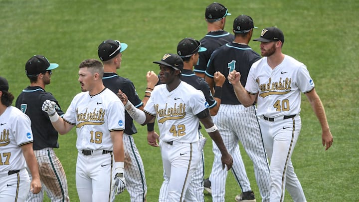 May 31, 2024; Clemson, SC, USA; Vanderbilt University players bump fists with Coastal Carolina University players after the NCAA Clemson Regional baseball game at Doug Kingsmore Stadium. 