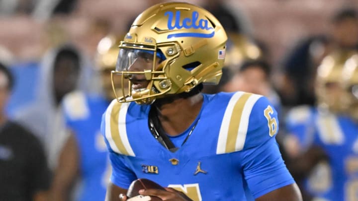 Sep 28, 2024; Pasadena, California, USA; UCLA Bruins quarterback Justyn Martin (6) looks for an open receiver during the fourth quarter against the Oregon Ducks at Rose Bowl. Mandatory Credit: Robert Hanashiro-Imagn Images