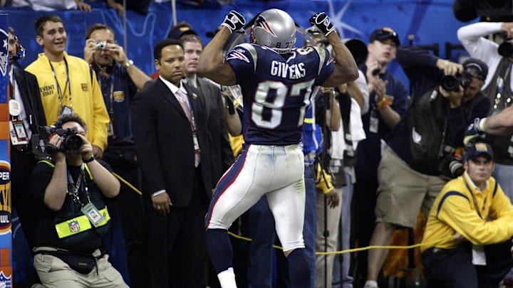 Feb 1, 2004; Houston, TX, USA; FILE PHOTO; New England Patriots receiver David Givens (87) reacts after catching a touchdown pass against the Carolina Panthers during Super Bowl XXXVIII at Reliant Stadium. The Patriots defeated the Panthers 32-29. Feb 1, 2004; Houston, TX, USA; FILE PHOTO; New England Patriots receiver David Givens (87) reacts after catching a touchdown pass against the Carolina Panthers during Super Bowl XXXVIII at Reliant Stadium. The Patriots defeated the Panthers 32-29.
