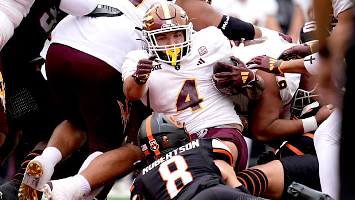 Arizona State Sun Devils running back Cam Skattebo (4) is tackled by Oklahoma State Cowboys safety Parker Robertson (8) in the first half the college football game between the Oklahoma State Cowboys and the Arizona State Sun Devils at Boone Pickens Stadium in Stillwater, OK, on Saturday, Nov. 2, 2024.