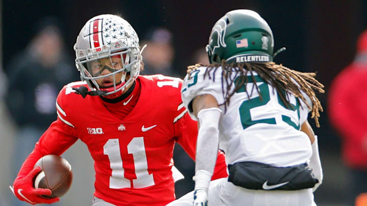 Ohio State Buckeyes wide receiver Jaxon Smith-Njigba (11) tries to get past Michigan State Spartans cornerback Marqui Lowery (29) after a catch in the second quarter during their NCAA College football game at Ohio Stadium in Columbus, Ohio on November 20, 2021.