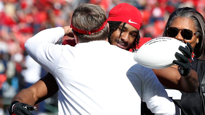 Georgia head coach Kirby Smart hugs Georgia running back Kenny McIntosh (6) during senior day before the start of a NCAA college football game between Georgia Tech and Georgia in Athens, Ga., on Saturday, Nov. 26, 2022.

News Joshua L Jones