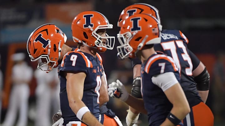 Sep 13, 2025; Champaign, Illinois, USA;  Illinois Fighting Illini quarterback Luke Altmyer (9) and teammates after a play during the second half against the Western Michigan Broncos at Memorial Stadium. Mandatory Credit: Ron Johnson-Imagn Images
