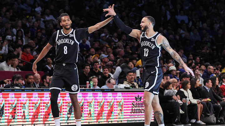 Mar 6, 2025; Brooklyn, New York, USA; Brooklyn Nets forward Ziaire Williams (8) and guard Tyrese Martin (13) celebrate during a timeout in the first quarter against the Golden State Warriors at Barclays Center. Mandatory Credit: Wendell Cruz-Imagn Images Mar 6, 2025; Brooklyn, New York, USA; Brooklyn Nets forward Ziaire Williams (8) and guard Tyrese Martin (13) celebrate during a timeout in the first quarter against the Golden State Warriors at Barclays Center. Mandatory Credit: Wendell Cruz-Imagn Images