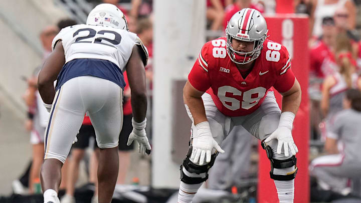 Aug 31, 2024; Columbus, OH, USA; Ohio State Buckeyes offensive lineman George Fitzpatrick (68) lines up across from Akron Zips running back Charles Kellom (22) during the NCAA football game at Ohio Stadium. Ohio State won 52-6.