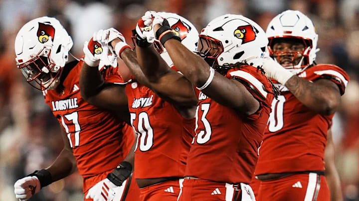 Louisville Cardinals defensive lineman Wesley Bailey (23) makes a heart gesture after his sack against James Madison University in the Card's football game Friday September 5, 2025 at L&N Credit Union Stadium in Louisville, Kentucky. After the game, Bailey said he always does a heart sign after a sack as an honor to his late mother, who was killed when he was five years old. Other Card players have followed his lead.
