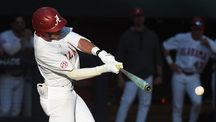 Feb 23, 2024; Tuscaloosa, Alabama, USA; Alabama batter Justin Lebron connects for a hit during the opening game of the weekend series with Valparaiso at Sewell-Thomas Stadium.