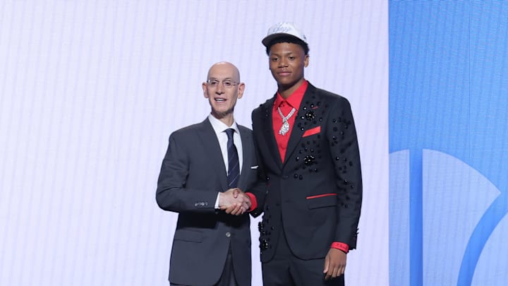Jun 25, 2025; Brooklyn, NY, USA;  Ace Bailey stands with NBA commissioner Adam Silver after being selected as the fifth pick by the Utah Jazz in the first round of the 2025 NBA Draft at Barclays Center. Mandatory Credit: Brad Penner-Imagn Images
