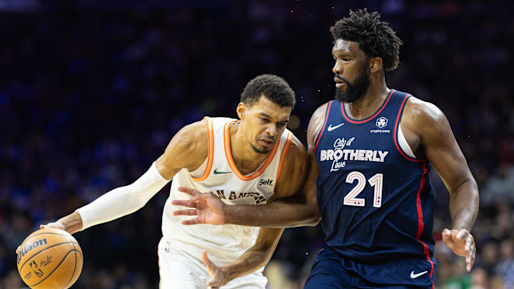 Jan 22, 2024; Philadelphia, Pennsylvania, USA; San Antonio Spurs center Victor Wembanyama (1) dribbles the ball against Philadelphia 76ers center Joel Embiid (21) during the third quarter at Wells Fargo Center. Mandatory Credit: Bill Streicher-Imagn Images