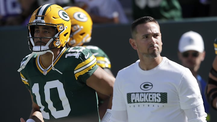 Sep 29, 2024; Green Bay, Wisconsin, USA;  Green Bay Packers quarterback Jordan Love (10) and head coach Matt LaFleur walk onto the field before the game against the Minnesota Vikings at Lambeau Field. Mandatory Credit: William Glasheen/USA TODAY Network via Imagn Images