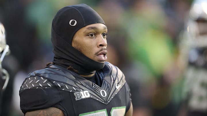Nov 30, 2024; Eugene, Oregon, USA; Oregon Ducks running back Jordan James (20) warms up before a game against the Washington Huskies at Autzen Stadium. Mandatory Credit: Troy Wayrynen-Imagn Images