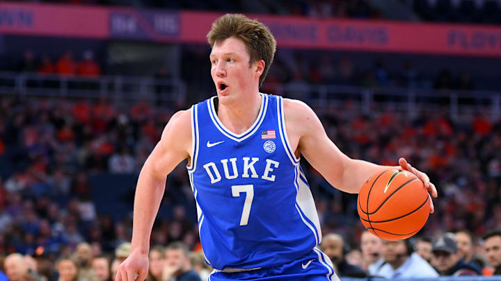 Feb 5, 2025; Syracuse, New York, USA; Duke Blue Devils guard Kon Knueppel (7) drives against the Syracuse Orange during the first half at the JMA Wireless Dome. Mandatory Credit: Rich Barnes-Imagn Images