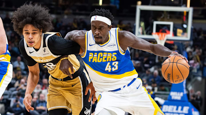 Dec 14, 2025; Indianapolis, Indiana, USA;  Indiana Pacers forward Pascal Siakam (43) dribbles the ball while  Washington Wizards forward Kyshawn George (18) defends in the first half at Gainbridge Fieldhouse. Mandatory Credit: Trevor Ruszkowski-Imagn Images