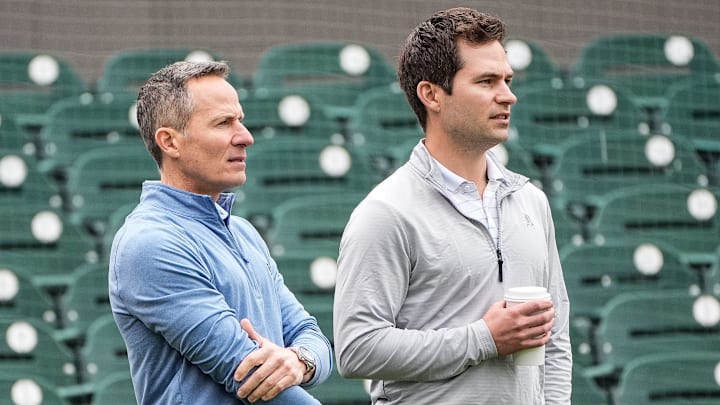 Detroit Tigers team owner Chris Ilitch, left, talks to president of baseball operation Scott Harris as they watch batting practice during spring training at Joker Marchant Stadium in Lakeland, Fla. on Thursday, Feb. 20, 2025.